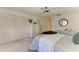 Bright bedroom with ample closet space and a ceiling fan at 3803 Wilshire W Cir # 37, Sarasota, FL 34238