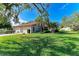 Two-story house with a two-car garage and a lush green lawn at 3803 Wilshire W Cir # 37, Sarasota, FL 34238