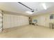 Spacious garage with ample storage cabinets and flooring at 3803 Wilshire W Cir # 37, Sarasota, FL 34238