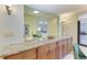 Granite countertop kitchen island with pass through to dining area at 3803 Wilshire W Cir # 37, Sarasota, FL 34238