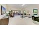 Spacious living room with a light-colored sofa and sliding glass doors at 3803 Wilshire W Cir # 37, Sarasota, FL 34238