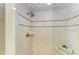 Tiled shower with built-in seat and glass enclosure at 3803 Wilshire W Cir # 37, Sarasota, FL 34238