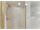 Walk-in shower with grab bar and tiled walls at 3803 Wilshire W Cir # 37, Sarasota, FL 34238