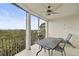 Balcony with outdoor furniture and tranquil nature views at 385 N Point Rd # 402, Osprey, FL 34229