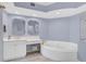 Bathroom with double vanity and soaking tub at 385 N Point Rd # 402, Osprey, FL 34229