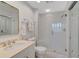 Clean bathroom with walk-in shower, tiled walls, and a modern vanity at 385 N Point Rd # 402, Osprey, FL 34229