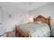 Bedroom with a wood bed frame and en-suite bathroom access at 385 N Point Rd # 402, Osprey, FL 34229