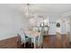 Bright dining room with light wood table and chairs at 385 N Point Rd # 402, Osprey, FL 34229