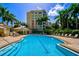 Resort-style pool with surrounding lounge chairs at 385 N Point Rd # 402, Osprey, FL 34229