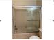 Bathroom with tub and sliding glass door at 3875 59Th W Ave # 3875, Bradenton, FL 34210