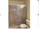 Bathroom with shower stall and tiled walls at 3875 59Th W Ave # 3875, Bradenton, FL 34210