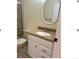 Bathroom vanity with sink and oval mirror at 3875 59Th W Ave # 3875, Bradenton, FL 34210