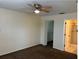 Bedroom with ceiling fan, carpet, and walk-in closet at 3875 59Th W Ave # 3875, Bradenton, FL 34210