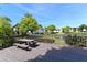 Community deck with picnic table and lake view at 3875 59Th W Ave # 3875, Bradenton, FL 34210