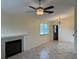 Living room with fireplace, tile floors, and ceiling fan at 3875 59Th W Ave # 3875, Bradenton, FL 34210