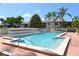 Community pool with surrounding lounge chairs at 3875 59Th W Ave # 3875, Bradenton, FL 34210