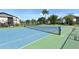 Community tennis court with blue and green surface at 3875 59Th W Ave # 3875, Bradenton, FL 34210