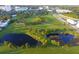 Aerial view of lush park with walking paths, ponds, and green spaces at 407 Gowdy Rd, Sarasota, FL 34237