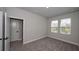 Spacious bedroom with plush carpeting and ample natural light at 407 Gowdy Rd, Sarasota, FL 34237