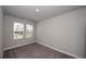 Bright bedroom featuring neutral walls and carpeted floors at 407 Gowdy Rd, Sarasota, FL 34237