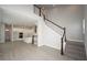 Open living room with modern staircase and light wood flooring at 407 Gowdy Rd, Sarasota, FL 34237