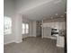 Open living space with kitchen and dining area views, hardwood floors at 407 Gowdy Rd, Sarasota, FL 34237