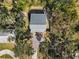 Aerial view of a house with a gray roof and driveway at 412 30Th E St, Palmetto, FL 34221