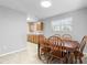 Bright dining area with wood table and chairs, adjacent to kitchen at 412 30Th E St, Palmetto, FL 34221