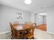 Dining area with wood table and chairs, view into living room at 412 30Th E St, Palmetto, FL 34221