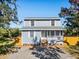 Two-story house with gray siding, white trim, and a wooden front porch at 412 30Th E St, Palmetto, FL 34221