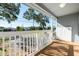 Front porch view with white railing and street view at 412 30Th E St, Palmetto, FL 34221