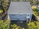 Rear view of a blue house with gray roof and small yard at 412 30Th E St, Palmetto, FL 34221