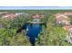 Community lake with fountain and clubhouse view at 4166 Central Sarasota Pkwy # 515, Sarasota, FL 34238