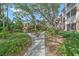 Landscaped community grounds with walking paths and lush foliage at 4166 Central Sarasota Pkwy # 515, Sarasota, FL 34238