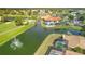 Aerial view of community pool, golf course, and residential homes at 4221 Augusta E Ter, Bradenton, FL 34203