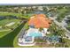 Aerial view of community pool, clubhouse, and golf course at 4221 Augusta E Ter, Bradenton, FL 34203