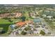 Aerial view of clubhouse, pool, and tennis courts at 4221 Augusta E Ter, Bradenton, FL 34203