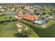 Aerial view of community clubhouse, pool, golf course, and tennis courts at 4221 Augusta E Ter, Bradenton, FL 34203