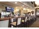 Elegant clubhouse bar with seating for patrons at 4221 Augusta E Ter, Bradenton, FL 34203