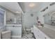 Elegant bathroom featuring a large shower and marble floors at 4221 Augusta E Ter, Bradenton, FL 34203