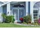 White double front doors with tropical screen design at 4221 Augusta E Ter, Bradenton, FL 34203