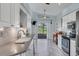 Bright kitchen with white cabinets, granite counters, and view of the golf course at 4221 Augusta E Ter, Bradenton, FL 34203