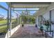 Spacious screened porch overlooking lush landscaping at 4221 Augusta E Ter, Bradenton, FL 34203