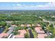 Aerial view of community showing building, pool, and tennis court at 4264 Central Sarasota Pkwy # 122, Sarasota, FL 34238