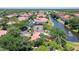 Aerial view of community showing building, pool, and tennis court at 4264 Central Sarasota Pkwy # 122, Sarasota, FL 34238