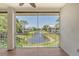 Screened balcony with tranquil water views and patio furniture at 4264 Central Sarasota Pkwy # 122, Sarasota, FL 34238