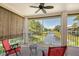 Screened balcony overlooking a canal, with patio furniture at 4264 Central Sarasota Pkwy # 122, Sarasota, FL 34238