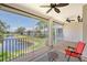 Spacious screened balcony with water views and ceiling fan at 4264 Central Sarasota Pkwy # 122, Sarasota, FL 34238