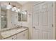 Bathroom boasting granite countertops and a large vanity at 4264 Central Sarasota Pkwy # 122, Sarasota, FL 34238