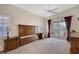 Main bedroom with private balcony access and ceiling fan at 4264 Central Sarasota Pkwy # 122, Sarasota, FL 34238